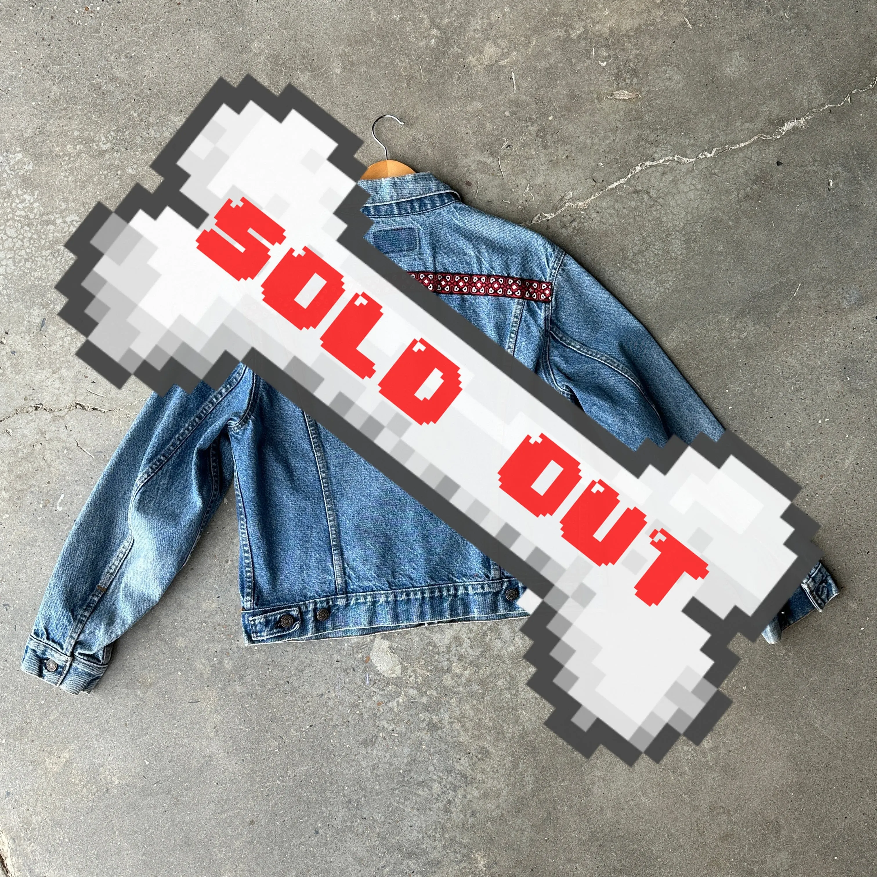 Levi's denim jacket with red, black, and white trim on front and back